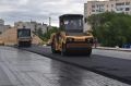 На мосту в створе улиц Шевченко и Смычки начали асфальтирование проезжей части